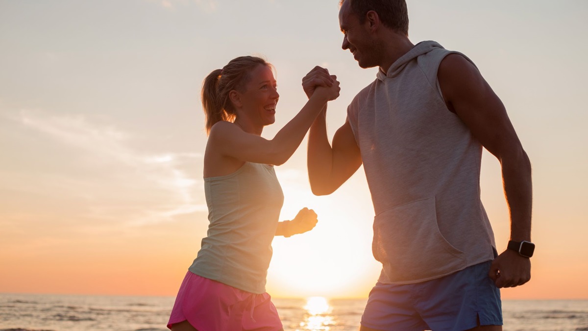 couple playing in the beach